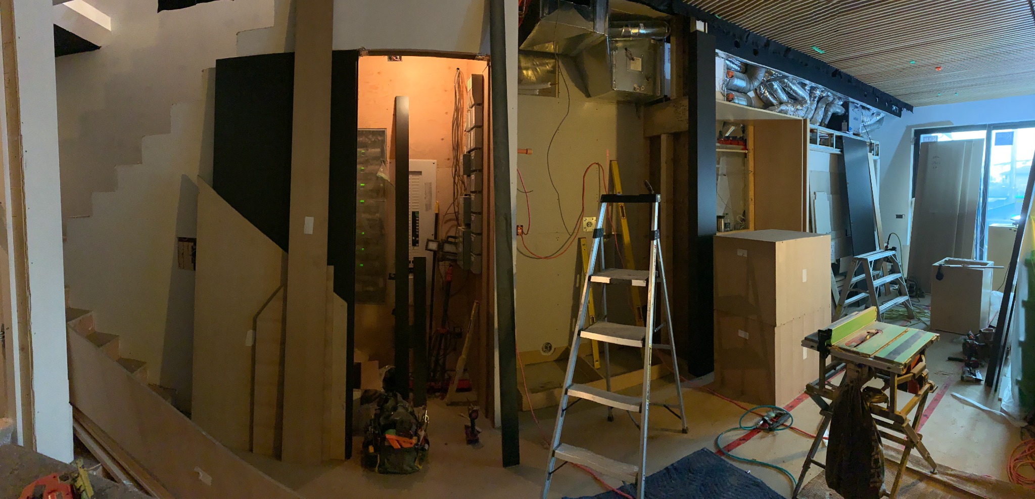 Wide view of a commercial feature-wall installation in progress